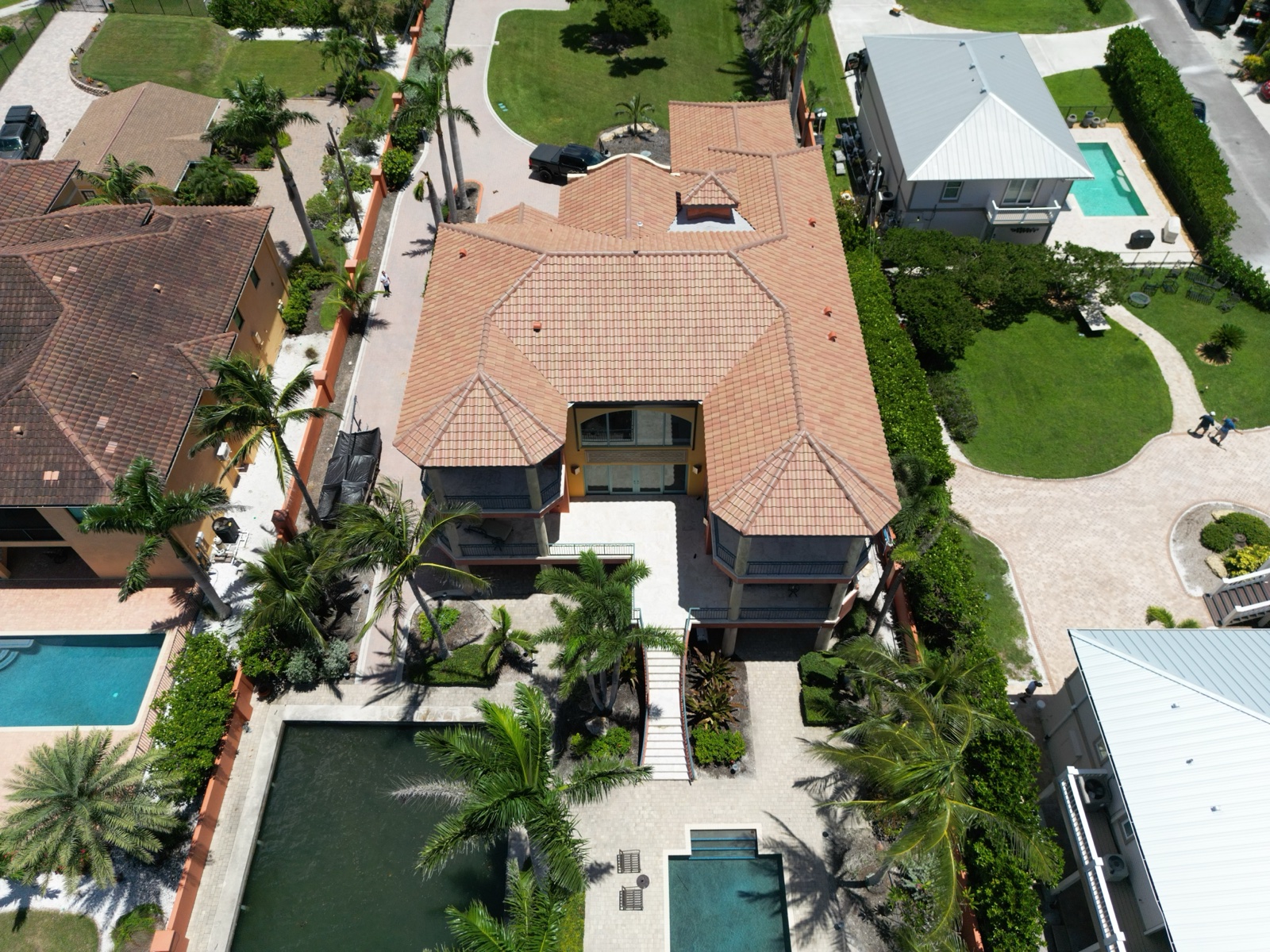Barrel tile roof on an elevated waterfront home with turret details